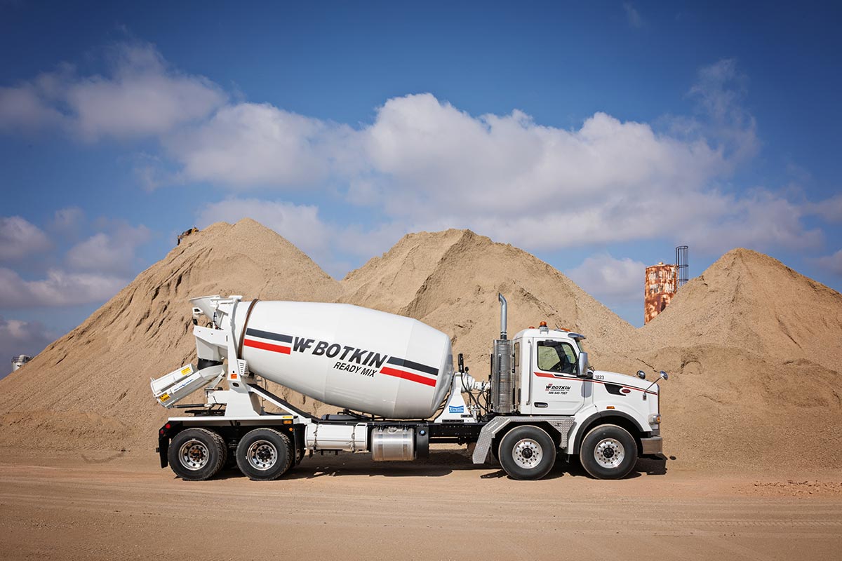 Cement mixer in front of aggregate Cement mixer in front of aggregate