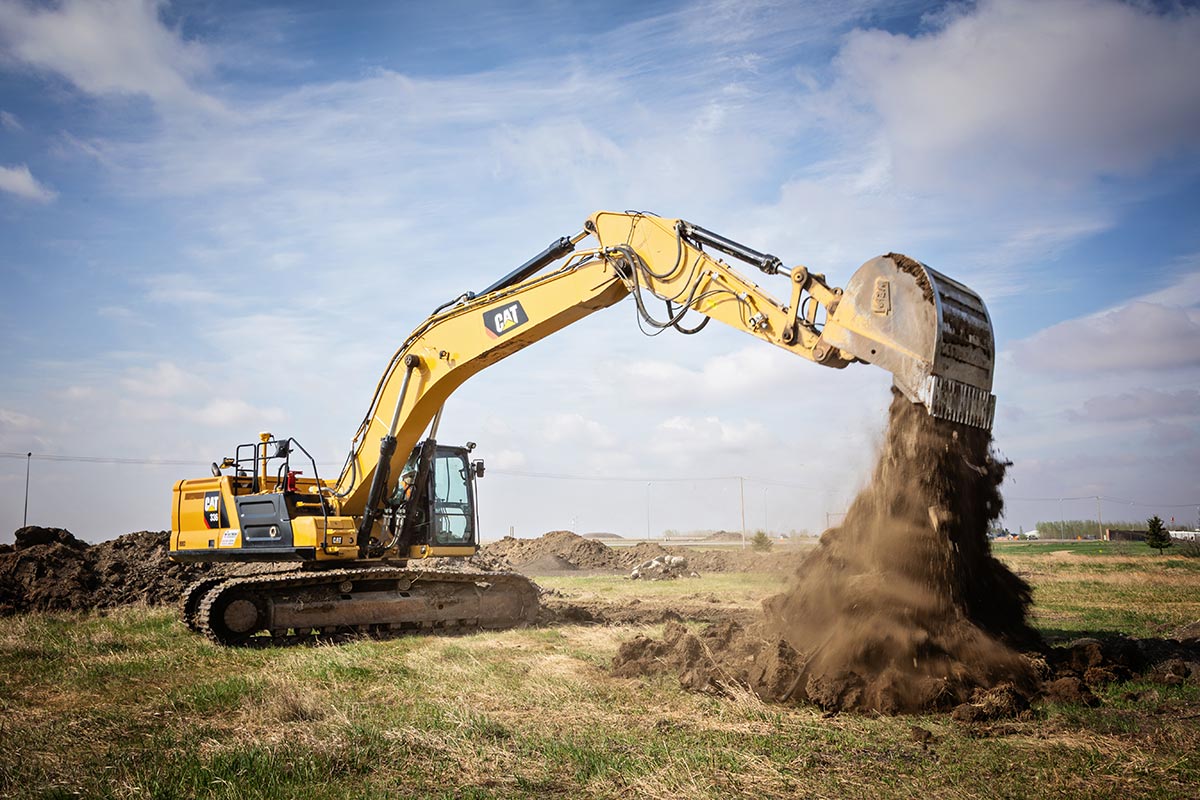 Digger trenching ground Digger trenching ground